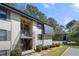Exterior shot of a two-story building with multiple units, each with a balcony at 89 De Arc Nw Pl, Atlanta, GA 30327