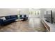 Living room featuring neutral walls and flooring, plush couch, and entertainment center at 89 De Arc Nw Pl, Atlanta, GA 30327