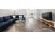 Comfortable living room area with natural light, modern furniture and wood-look floors at 89 De Arc Nw Pl, Atlanta, GA 30327
