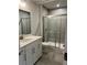 Bathroom featuring a glass shower and vanity with white cabinets at 138 Briargate Dr, Johns Creek, GA 30097