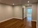 Hardwood flooring in bedroom with neutral colored walls at 138 Briargate Dr, Johns Creek, GA 30097