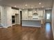 Spacious kitchen features a large island, modern appliances, and hardwood floors at 138 Briargate Dr, Johns Creek, GA 30097