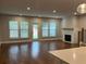 Bright living room features hardwood floors, fireplace, and lots of natural light at 138 Briargate Dr, Johns Creek, GA 30097