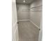 Walk-in closet with carpet floors and wire shelving at 138 Briargate Dr, Johns Creek, GA 30097