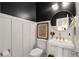 Powder room featuring a black ceiling and white wainscoting at 1814 Dupont Nw Ave, Atlanta, GA 30318