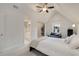 Bright bedroom featuring a ceiling fan, vaulted ceilings, window, and cozy decor for a relaxing ambiance at 1814 Dupont Nw Ave, Atlanta, GA 30318