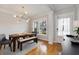 Dining room featuring hardwood floors, designer lighting, and an adjacent doorway at 1814 Dupont Nw Ave, Atlanta, GA 30318