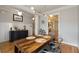 Dining room featuring hardwood floors, designer lighting, and an adjacent doorway at 1814 Dupont Nw Ave, Atlanta, GA 30318