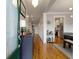 Inviting home hallway featuring hardwood floors, stylish decor, and access to the kitchen at 1814 Dupont Nw Ave, Atlanta, GA 30318