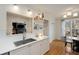 Kitchen area featuring white cabinets and countertops with stainless steel sink at 1814 Dupont Nw Ave, Atlanta, GA 30318