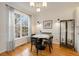Eat-in kitchen featuring hardwood floors, natural light, and white trim at 1814 Dupont Nw Ave, Atlanta, GA 30318