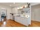 Bright, open kitchen with white cabinets, modern appliances, and wood floors, perfect for cooking at 1814 Dupont Nw Ave, Atlanta, GA 30318