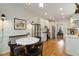 Eat-in kitchen area featuring hardwood floors, white cabinets and stainless appliances at 1814 Dupont Nw Ave, Atlanta, GA 30318