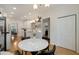 Bright kitchen featuring white cabinets, hardwood floors, and a marble table at 1814 Dupont Nw Ave, Atlanta, GA 30318