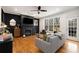 Cozy living room featuring hardwood floors, black accent wall, and natural light at 1814 Dupont Nw Ave, Atlanta, GA 30318