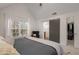 Bedroom showcasing a view of an ensuite bath and walk-in closet, offering a private and luxurious retreat at 1814 Dupont Nw Ave, Atlanta, GA 30318