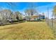 Fenced backyard with sunny grass and an outside shelter, perfect for entertaining at 638 Bryan Se St, Atlanta, GA 30312