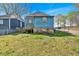 Charming view of the exterior of a house with blue siding and a stone foundation at 638 Bryan Se St, Atlanta, GA 30312