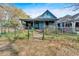 Charming home with a welcoming porch, partially surrounded by a chain link fence at 638 Bryan Se St, Atlanta, GA 30312
