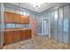 View of the kitchen featuring metal panel walls and wood cabinets with laminate countertops at 638 Bryan Se St, Atlanta, GA 30312