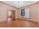 A bright living room features hardwood floors and a vintage chandelier at 638 Bryan Se St, Atlanta, GA 30312