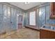 A functional room with metal walls, and tile flooring has a utility sink at 638 Bryan Se St, Atlanta, GA 30312