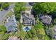 Aerial view of the home, surrounding yards, in-ground pool, landscaping, and neighborhood streets at 2314 Edgemere Lake Cir, Marietta, GA 30062