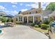 Expansive backyard with pool, covered patio, lush landscaping, and an outdoor kitchen for entertaining at 2314 Edgemere Lake Cir, Marietta, GA 30062