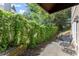 Backyard patio with ivy-covered fence, an outdoor staircase, and wrought iron seating area at 2314 Edgemere Lake Cir, Marietta, GA 30062