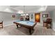 Wide finished basement showcasing a pool table, wet bar, and game room at 2314 Edgemere Lake Cir, Marietta, GA 30062