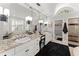 Luxury bathroom features a double vanity with marble countertops, a shower, and ample cabinet space at 2314 Edgemere Lake Cir, Marietta, GA 30062