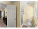 Bathroom featuring a shower-tub combo with white tiling and a window at 2314 Edgemere Lake Cir, Marietta, GA 30062