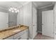 Bathroom featuring a single vanity with granite countertops and a large mirror, offering a functional space at 2314 Edgemere Lake Cir, Marietta, GA 30062