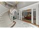 Grand foyer with a sweeping staircase, marble floors, and elegant architectural details at 2314 Edgemere Lake Cir, Marietta, GA 30062