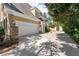 Charming garage with stone accents and long driveway providing ample parking space for multiple vehicles at 2314 Edgemere Lake Cir, Marietta, GA 30062