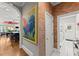 Stylish hallway leading to a modern kitchen with stainless steel appliances and ample natural light at 2314 Edgemere Lake Cir, Marietta, GA 30062