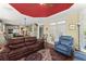 Open living area with hardwood floors, comfortable seating, a ceiling fan and access to the kitchen at 2314 Edgemere Lake Cir, Marietta, GA 30062