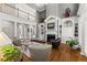 Elegant living room with high ceilings, fireplace, built-in shelving, and comfortable seating at 2314 Edgemere Lake Cir, Marietta, GA 30062