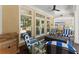 Inviting covered patio with comfortable seating, perfect for entertaining, with white trim and a light tan wall at 2314 Edgemere Lake Cir, Marietta, GA 30062