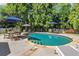 Beautiful in-ground pool with surrounding lounge area and lush landscaping, ideal for summer relaxation at 2314 Edgemere Lake Cir, Marietta, GA 30062