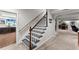 Basement staircase leading to a large rec room with carpet flooring at 2314 Edgemere Lake Cir, Marietta, GA 30062