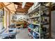 Organized workshop with workbenches, tools, storage shelves, and natural light at 2314 Edgemere Lake Cir, Marietta, GA 30062