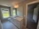Bathroom featuring a large mirror, white cabinets, and a window for natural light at 315 Lakeside Ct, Canton, GA 30114