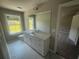 Bathroom featuring a large mirror, white cabinets, and a window for natural light at 315 Lakeside Ct, Canton, GA 30114