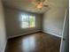Inviting bedroom with hardwood floors, natural light, and a ceiling fan at 315 Lakeside Ct, Canton, GA 30114