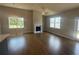 Bright living room with a fireplace, hardwood floors, and backyard views at 315 Lakeside Ct, Canton, GA 30114