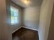 Bright room featuring hardwood floors, a window, and neutral paint, perfect for office or flex space at 315 Lakeside Ct, Canton, GA 30114
