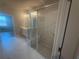 Luxurious walk-in shower with elegant tile work, a built-in bench, and glass enclosure at 315 Lakeside Ct, Canton, GA 30114