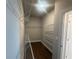 Spacious walk-in closet equipped with ample shelving for organized storage at 315 Lakeside Ct, Canton, GA 30114