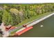 Aerial view of lakeshore showcasing access ramps and small docks at 315 Monroe Dr, Mcdonough, GA 30252
